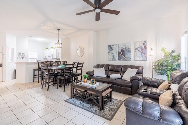 living room with light tile patterned floors and ceiling fan