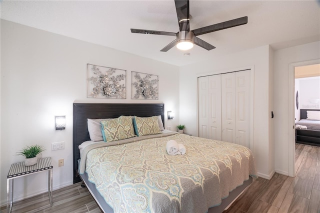 bedroom featuring ceiling fan and a closet