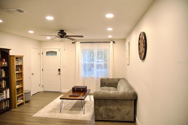 sitting room featuring hardwood / wood-style flooring and ceiling fan