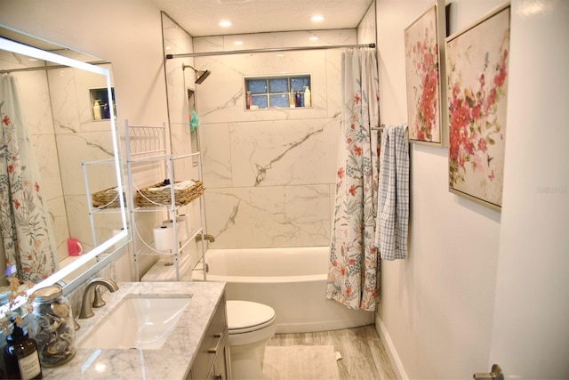 full bathroom featuring hardwood / wood-style flooring, toilet, vanity, and shower / bath combo with shower curtain