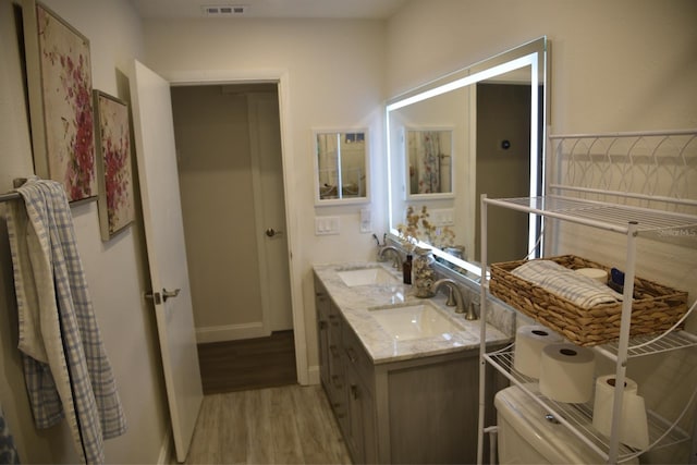 bathroom with vanity and hardwood / wood-style floors