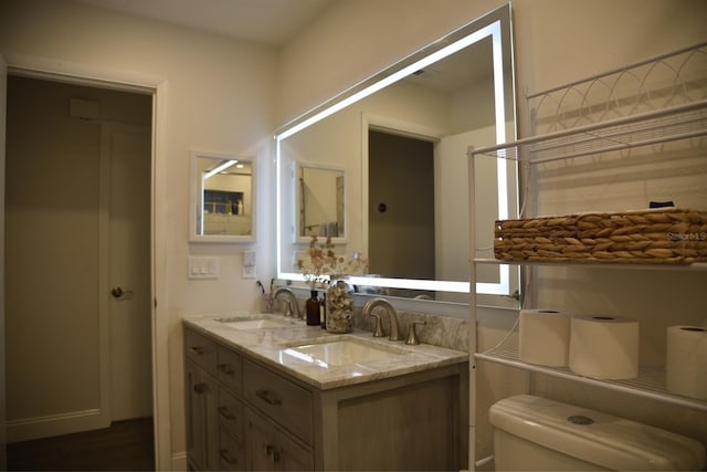 bathroom with vanity and toilet