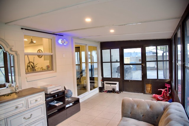 tiled living room featuring lofted ceiling and a wall mounted AC