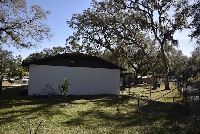 view of property exterior featuring a lawn