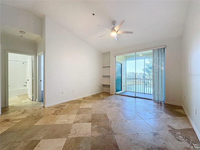 empty room featuring lofted ceiling and ceiling fan