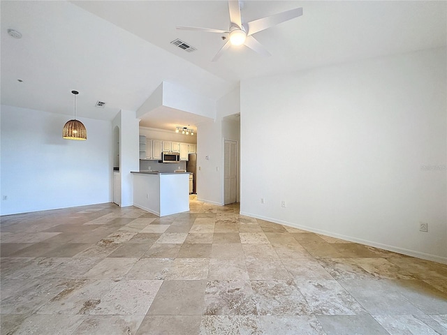 unfurnished living room with ceiling fan and lofted ceiling