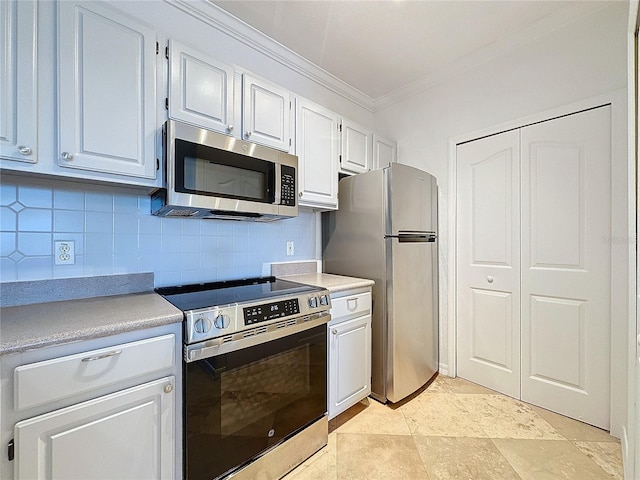 kitchen featuring white cabinetry, stainless steel appliances, crown molding, and backsplash