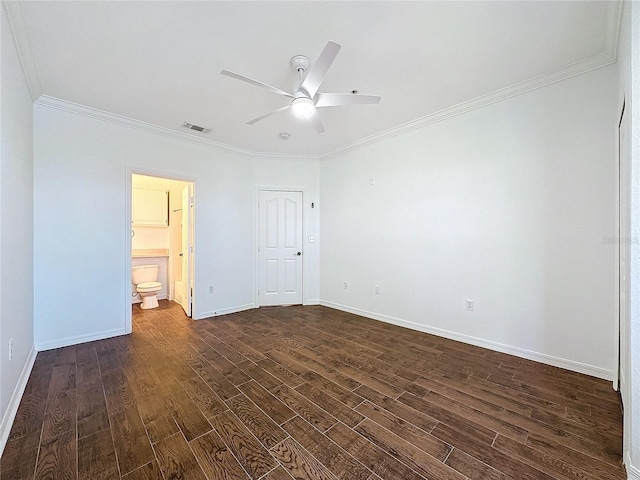 unfurnished bedroom featuring crown molding, dark wood-type flooring, connected bathroom, and ceiling fan