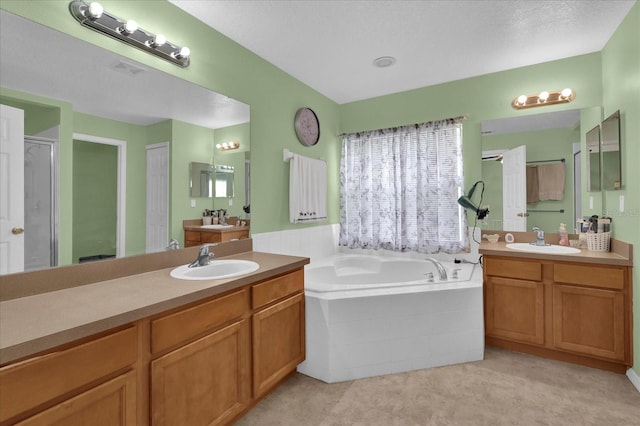 bathroom with shower with separate bathtub and vanity