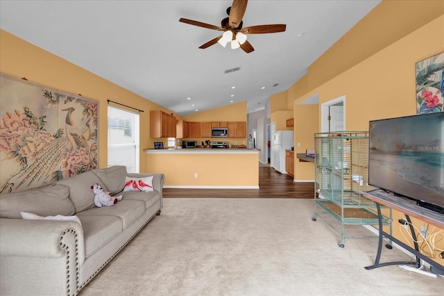 carpeted living room with lofted ceiling and ceiling fan