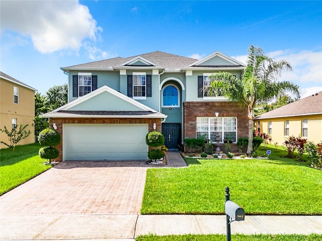 view of front facade featuring a garage and a front yard