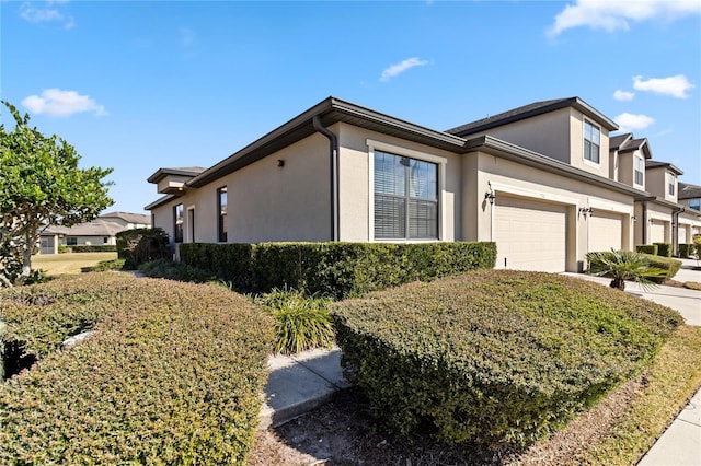 view of side of property with a garage