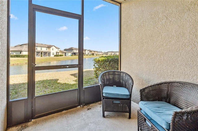 sunroom with a water view