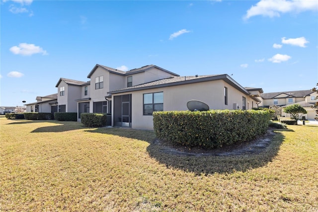 rear view of property with a yard