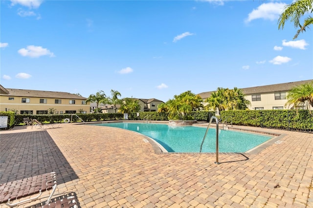 view of swimming pool with a patio area