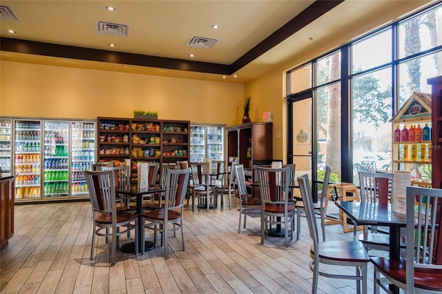 dining area with plenty of natural light and light hardwood / wood-style floors