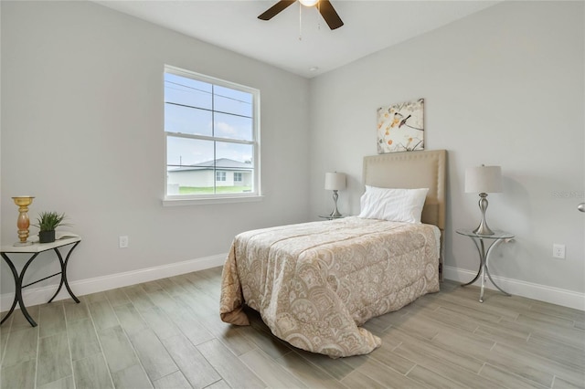 bedroom featuring ceiling fan and light hardwood / wood-style flooring