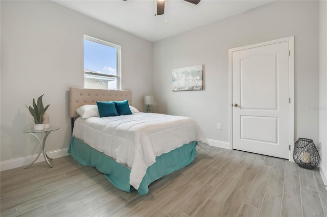 bedroom with ceiling fan and light wood-type flooring