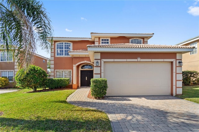 mediterranean / spanish home with a front lawn