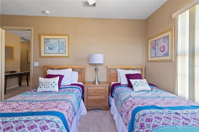 bedroom featuring light colored carpet