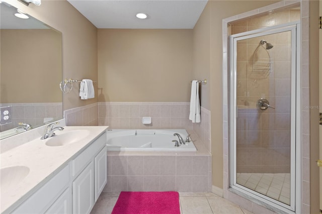 bathroom with vanity, independent shower and bath, and tile patterned flooring