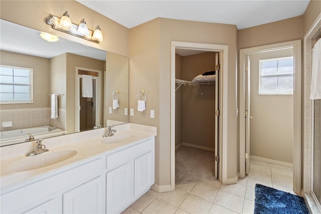 bathroom featuring vanity, tile patterned floors, and separate shower and tub