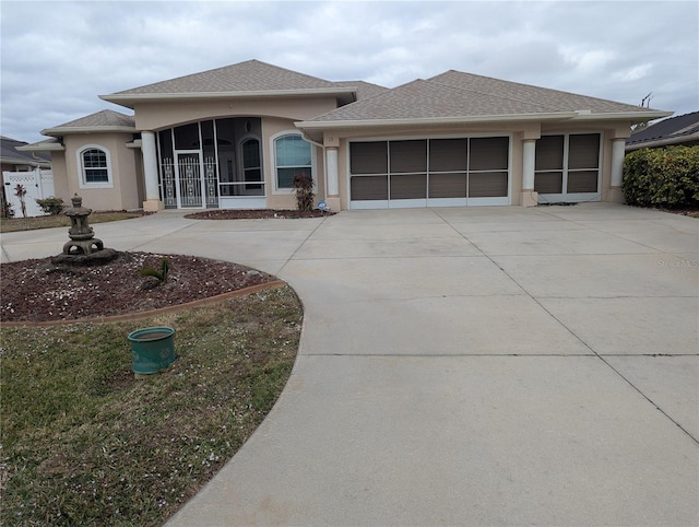 view of front of property with a garage