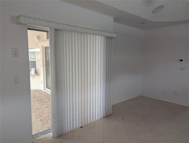 view of tiled spare room