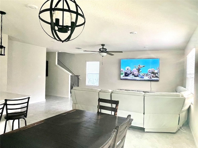 tiled dining room with ceiling fan