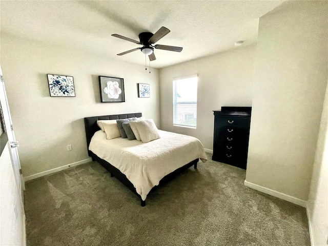 bedroom featuring carpet floors, a textured ceiling, and ceiling fan