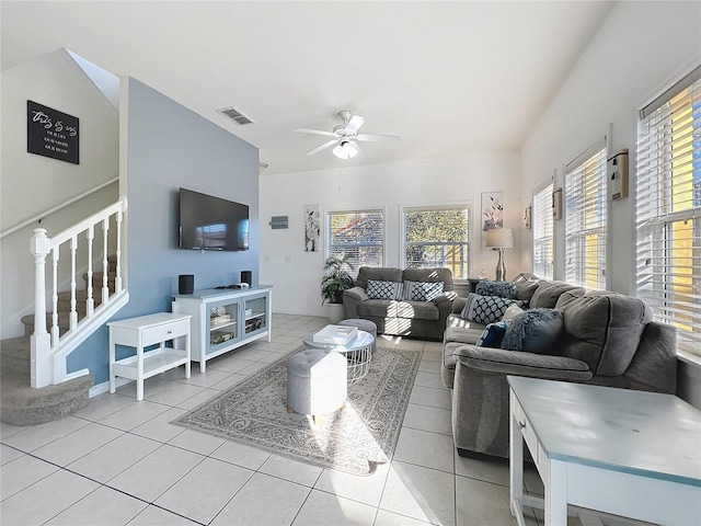 tiled living room with ceiling fan