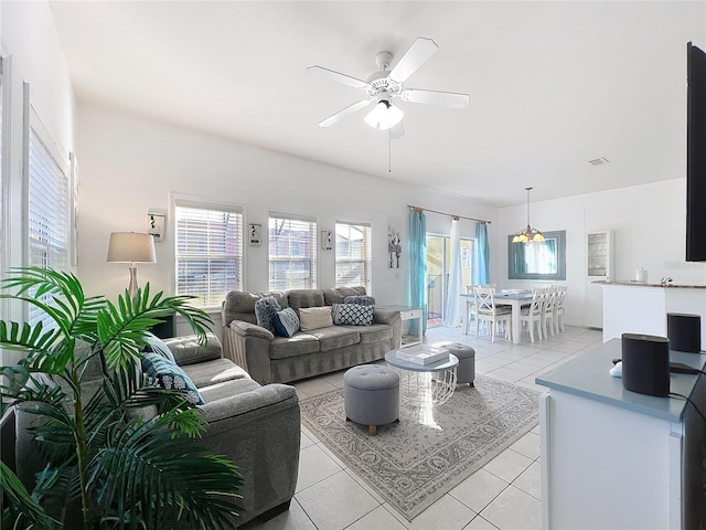 tiled living room with ceiling fan