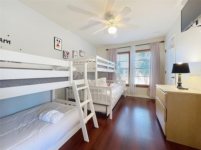 bedroom featuring ceiling fan and dark hardwood / wood-style flooring