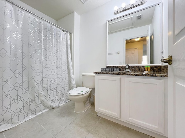 bathroom with tile patterned floors, vanity, toilet, and a shower with shower curtain