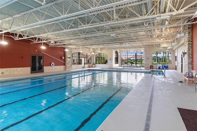 community pool with a patio and french doors