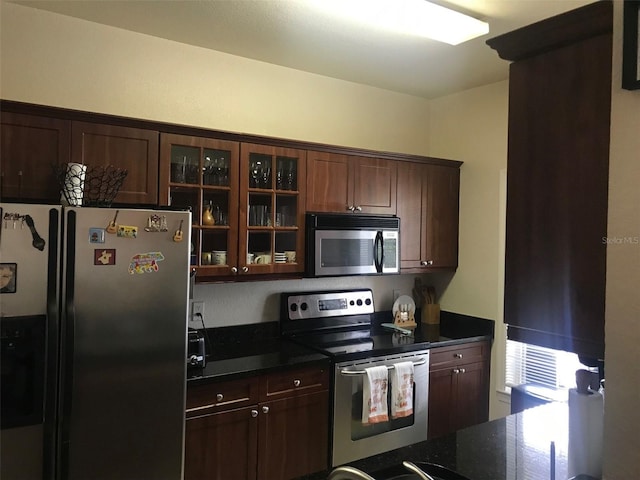 kitchen featuring dark brown cabinetry and stainless steel appliances