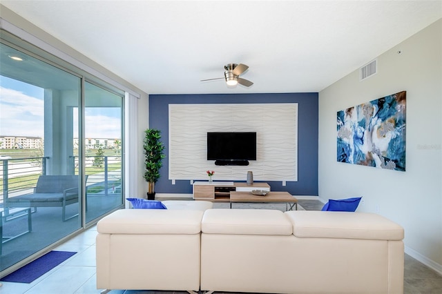 tiled living room featuring ceiling fan