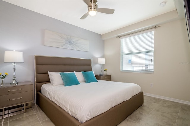 tiled bedroom with ceiling fan