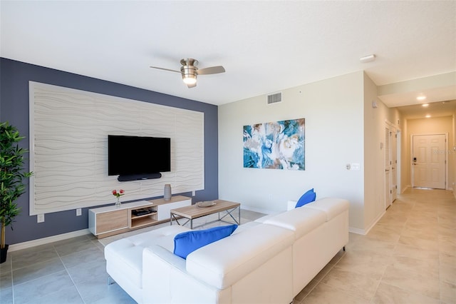 living room with ceiling fan and light tile patterned floors