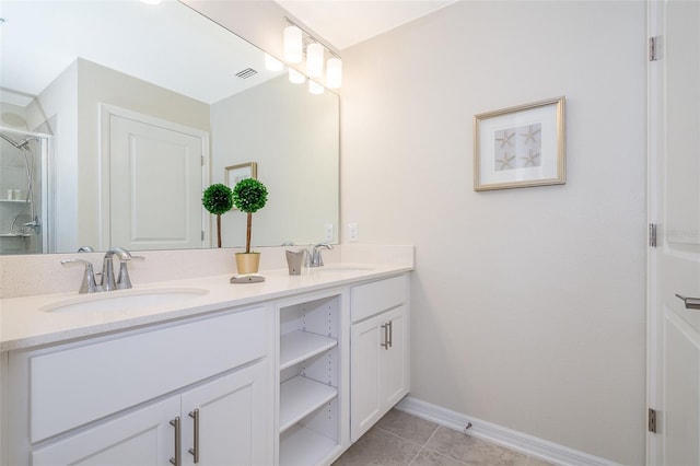 bathroom with vanity, an enclosed shower, and tile patterned flooring