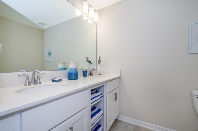 bathroom with vanity and tile patterned flooring