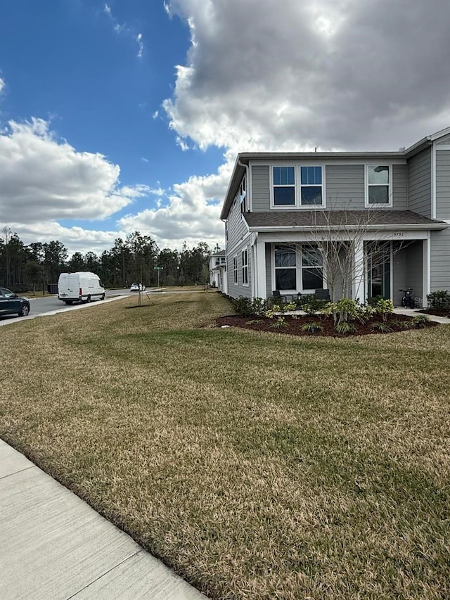 view of home's exterior with a yard