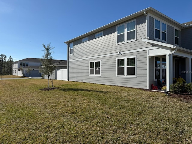 view of side of property featuring a yard