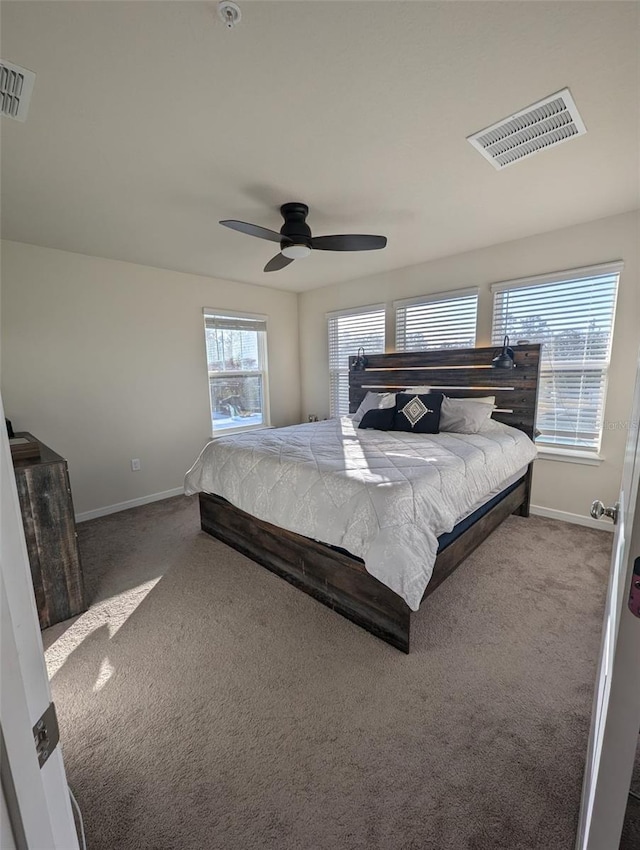 bedroom with ceiling fan and carpet floors