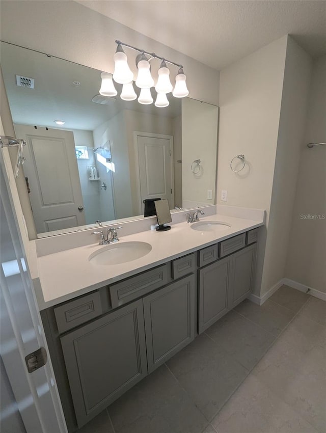 bathroom with vanity and tile patterned flooring