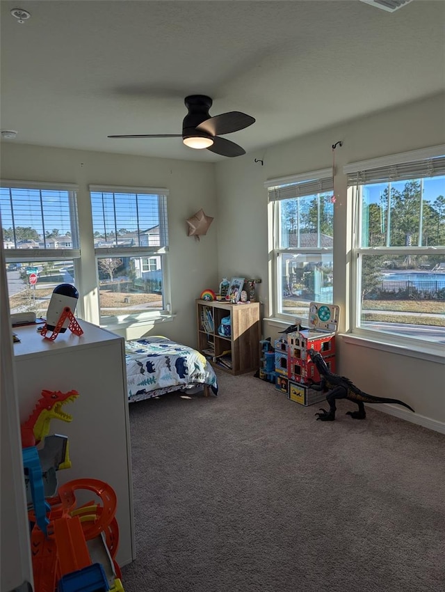 carpeted bedroom with ceiling fan