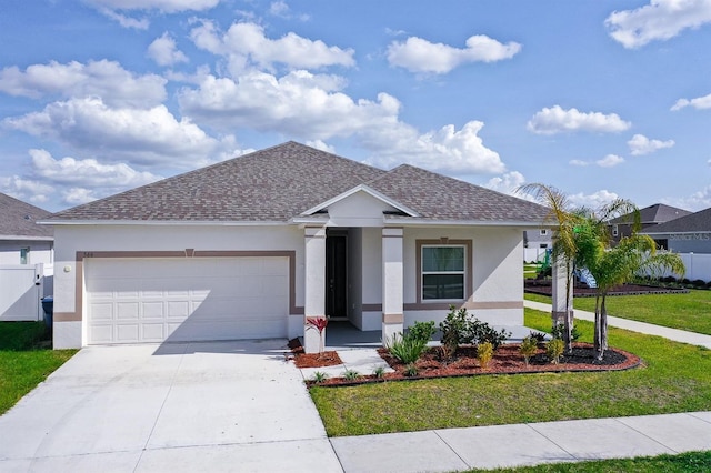 view of front of property with a garage and a front yard