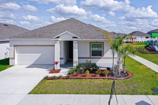 ranch-style home with a garage and a front yard