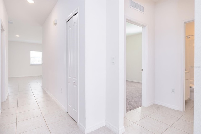 hallway with light tile patterned floors