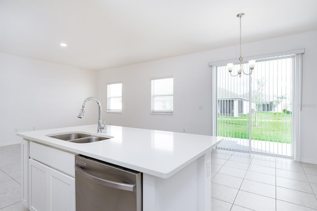 kitchen featuring sink, a center island with sink, dishwasher, pendant lighting, and white cabinets